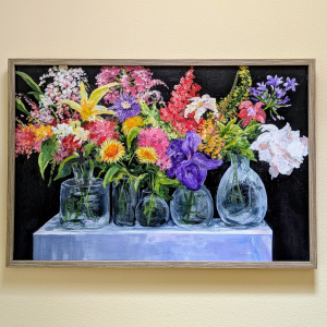 Acrylic painting of bright flowers in vases hanging on a gallery wall